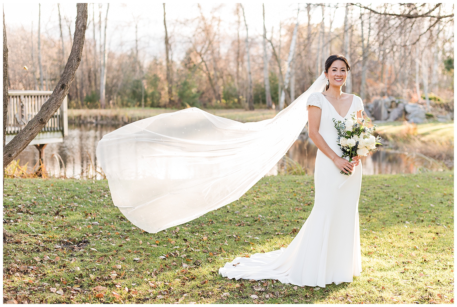 bride with veil flowing at holland marsh winery